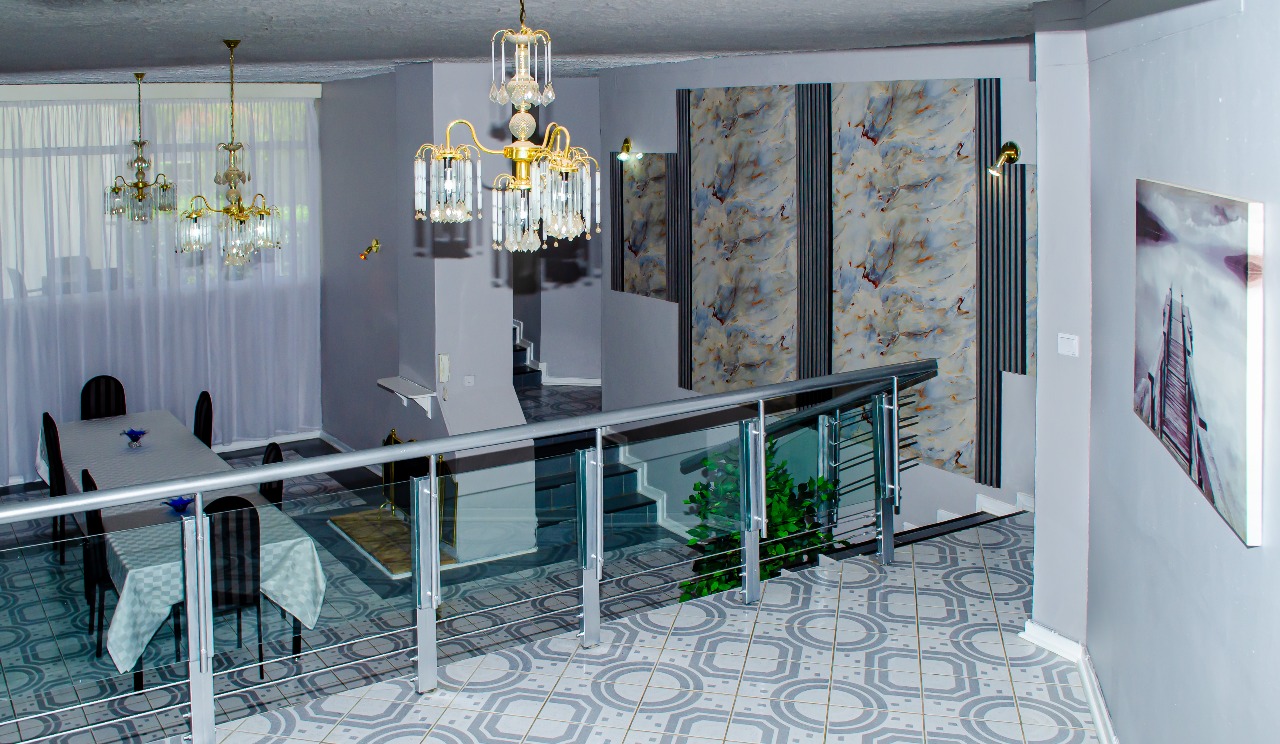 Castle Rock Guesthouse elegant interior with marble walls and modern staircase